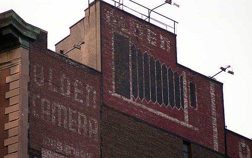 Olden Camera Sign on building 