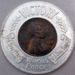 Victory Encased Obverse type 1 with scrolls and laurel - Victory at top World Peace at bottom - V-E Day May 8 at left V-J Day Sept 2 on right